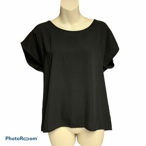 Francesca’s black back zippered top S